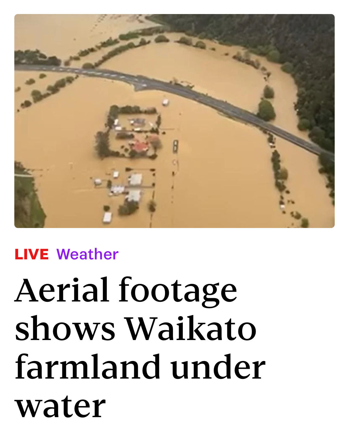 Screenshot of headline reading
LIVE weather
Aerial footage shows Waikato farmland under water.
Picture shows a flooded farm from the air only treetops and a raised road poke out of the water.