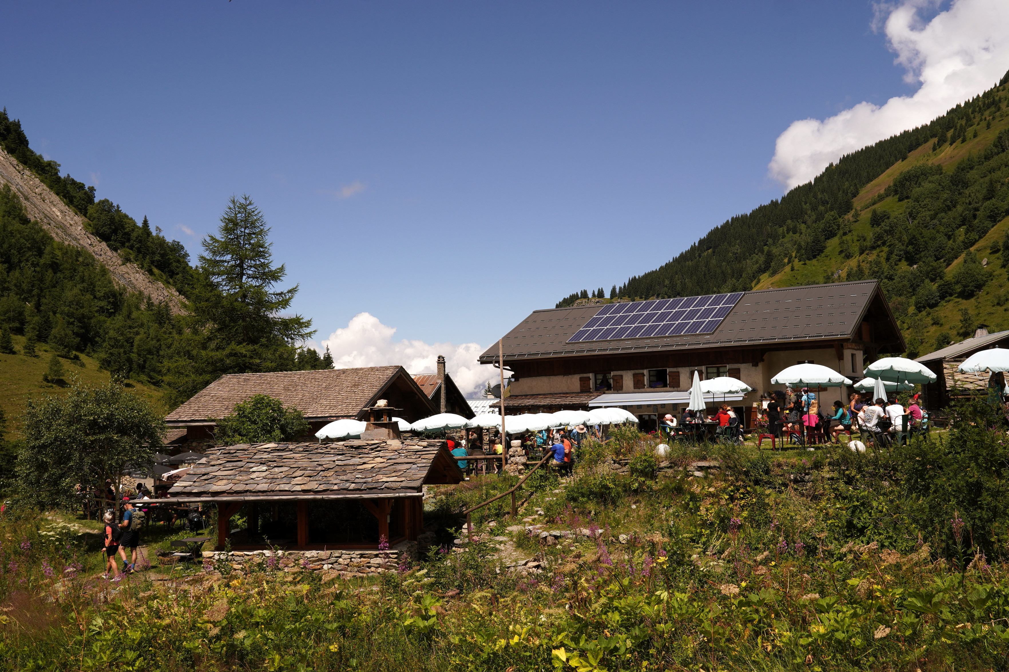A popular Refuge de Miage, with solar panels, picnic areas with umbrellas, and lots of hikers. It is not accessible by road.