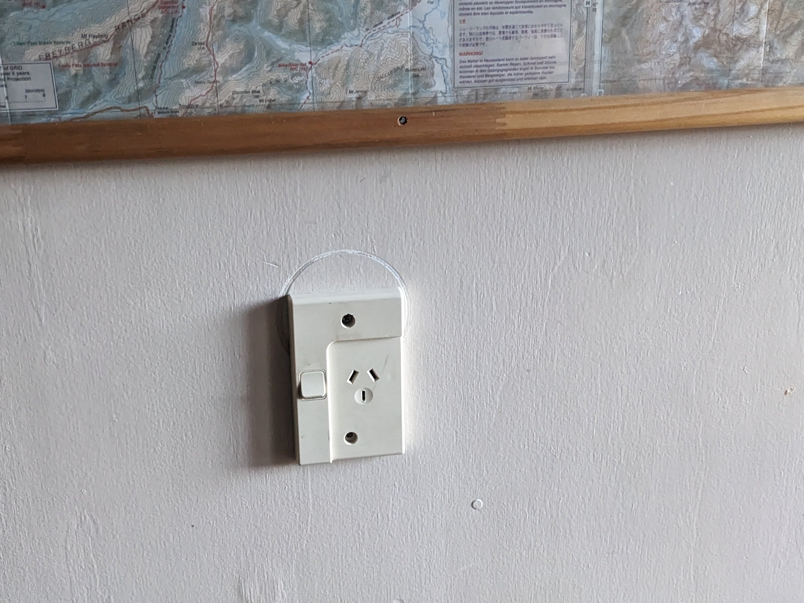 Looks like a power outlet in a hut. This hut, however, does not have power. Just the outlet.