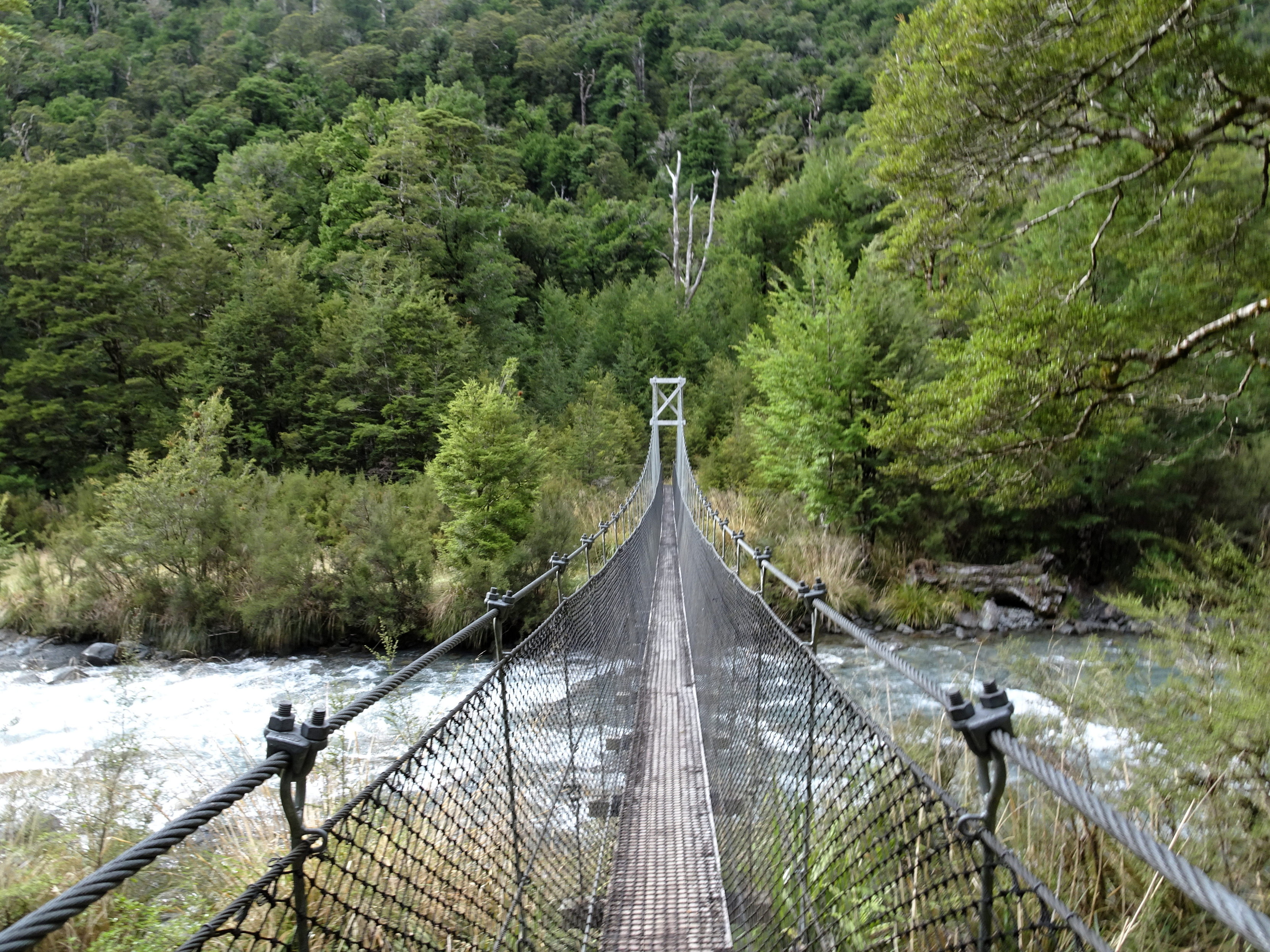 A narrow swingbridge across a wide and fast-moving river. Glad I don't have to do that river crossing!