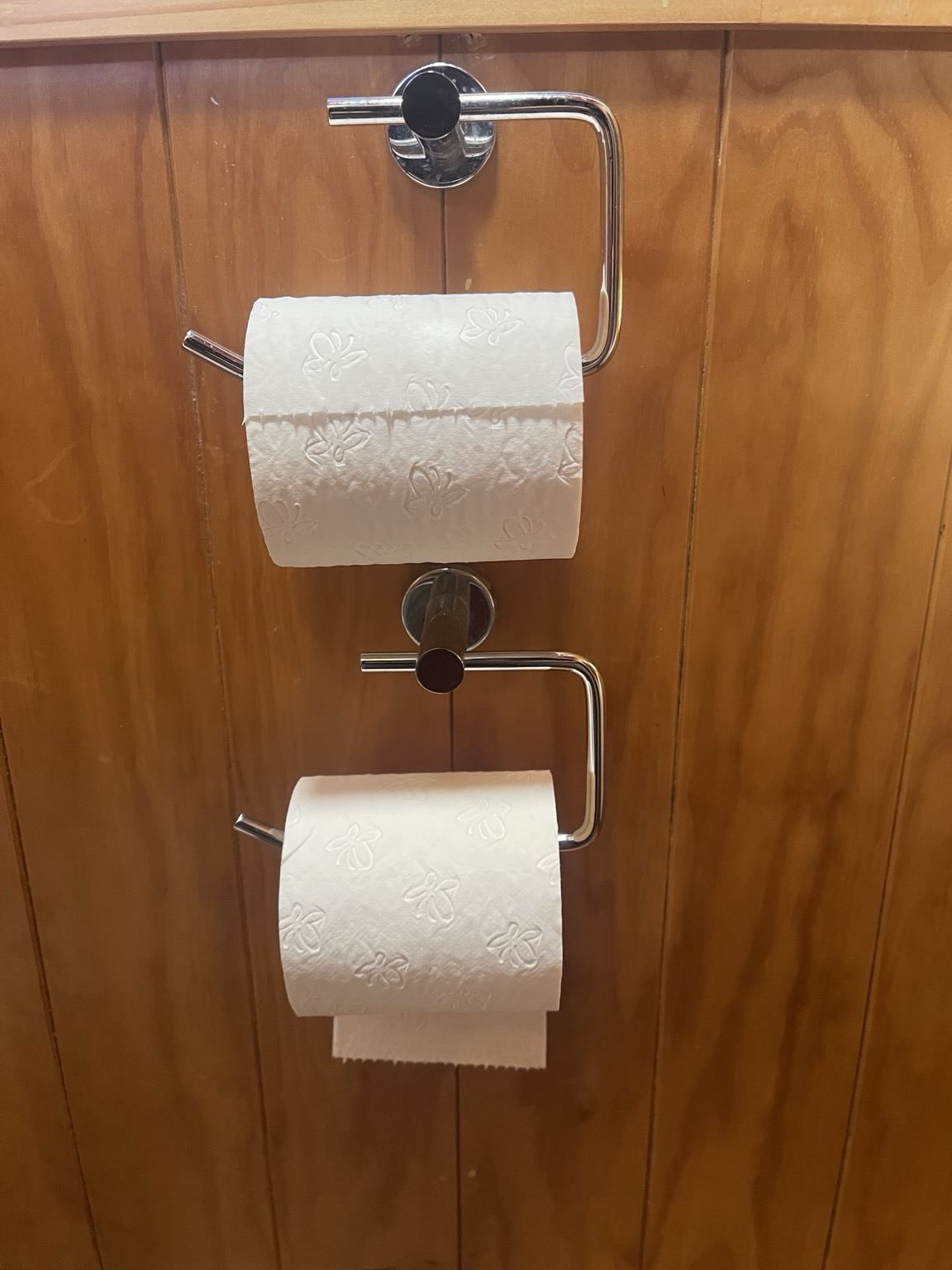 2 toilet roll holders, one under, one over.